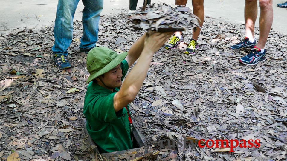 Demonstrating how the Cu Chi tunnels were concealed.